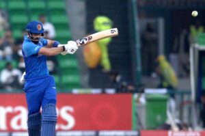 Afghanistan player Ibrahim Zadran plays a shot during the ICC Champions Trophy one-day international (ODI) cricket match between Afghanistan and England at the Gaddafi Stadium.