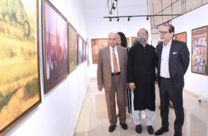 The President of the Arts Council Muhammad Ahmad Shah is looking at the artworks in the exhibition organized on the artworks of the world-renowned artist Jimmy Engineer, organized by the Arts Council of Pakistan Karachi.