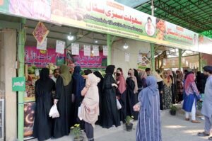 Women in a queue to purchase different items from Ramzan Sahulat Bazar organized by Punjab Govt at Modal Mart