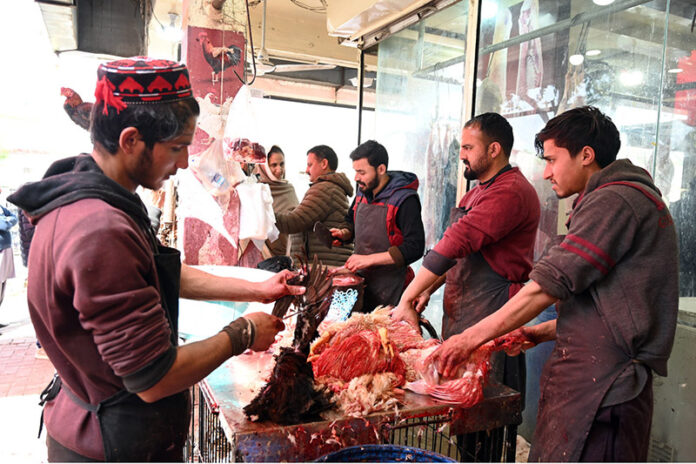 People purchasing meat at G-7 market in the Federal Capital