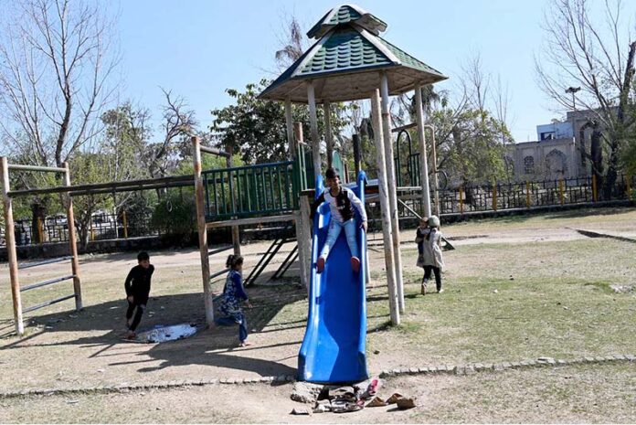 Children enjoy swings at local Park near G-7 area in the Federal Capital