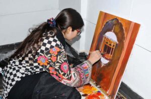 Students participating in a painting competition in connection with Punjab Culture Day organized by the Punjab Council of the Arts, Multan Division.