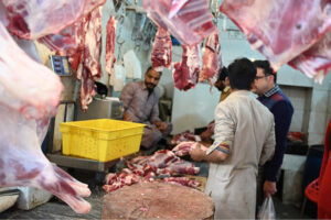 People purchasing meat at G-7 market in the Federal Capital