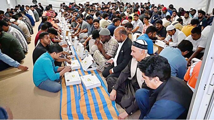 Ambassador Faisal Niaz Tirmizi, Pakistan's Envoy to the UAE, joins attendees for Iftar meal at the Ramadan Iftar tent setup by Vista Maritime Travel and Tourism at Port Rashid