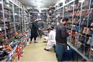 A vendor displaying and selling traditional Peshawari Chappal to attract customers at G-9 in the Federal Capital.