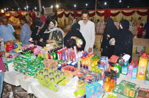 Women busy purchasing grocery items from the Ramadan Bachat Bazaar during the holy month of Ramadan-ul-Mubarak in Latifabad.