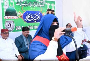 A student reciting a Naat during the Natiya Mushaira at Begum Nusrat Bhutto Government Girls Degree College.