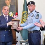 Prime Minister Muhammad Shehbaz Sharif awarding cheques and shields to the FIA and IB officials who nabbed notorious gang leader involved in human trafficking