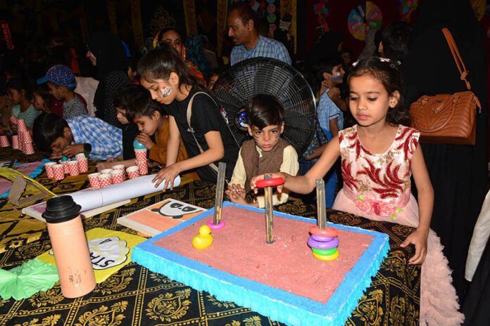 Students enjoy playing games during open day fun festival of local school at Afandi town