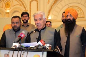 Defence Minister Khawaja Muhammad Asif addressing the ceremony for distributing Chief Minister Punjab Minority Cards at a local hotel.