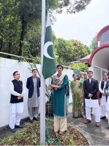 High Commissioner Rabia Shafiq hoisting the national flag on Pakistan Day, at Pakistan House.