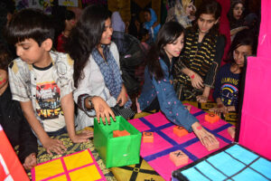 Students enjoy playing games during open day fun festival of local school at Afandi town