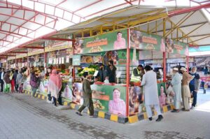 People are buying various items at subsidized rates from the Ramadan Bazaar along Jhang Road.