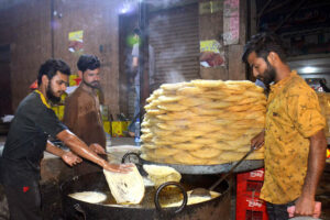 Workers busy making traditional vermicelli (Pheoni) to meet the rising demand ahead of Eid al-Fitr.