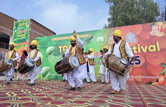 Artist performing on stage during Guava and Orange Festival organized by TDCP at Sargodha Arts Council