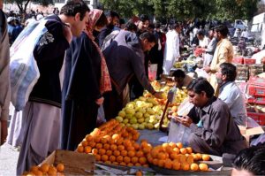 People purchasing different food items from stall for iftar at Sasta Ramadan bazaar Aabpara in the Federal Capital