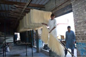 Workers are busy preparing vermicelli (Sawiyyan) at a local food factory, as these sweet delicacies are in high demand on the eve of Eid-ul-Fitr, a festive occasion celebrated with traditional dishes and joyous gatherings.