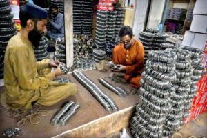 Workers are sorting and arranging bangles at the Bangle Market after preparing them, ready to be transported to other markets.