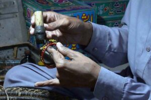 Workers are sorting and arranging bangles at the Bangle Market after preparing them, ready to be transported to other markets.