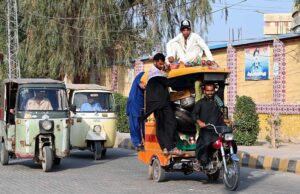 A person traveling on the rooftop of overloaded tricycle rickshaw at DIG Office Road may cause any fatal mishap and needs attention of concerned authorities