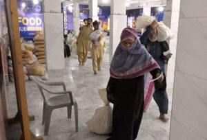 Deserving people receiving Ramadan Gift package by Alkhidmat foundation at Tabligh-e-Islam Makki Shah.