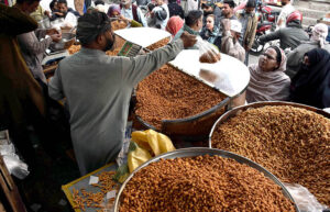 People purchasing the traditional food item (Pakoriyaa) mostly used in Dahi Bhalle during the holy fasting month of Ramzan