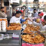 People purchasing traditional food items for iftari during the holy month of Ramazan at Latifabad