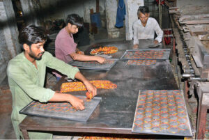 Workers are busy in preparing the bangles at local bangles factory in connection with upcoming Eidul Fitr.