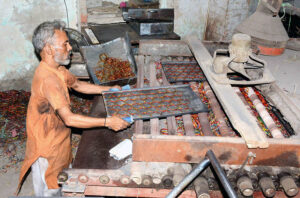 Workers are busy in preparing the bangles at local bangles factory in connection with upcoming Eidul Fitr.