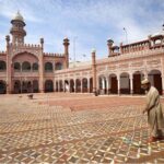 A volunteer diligently washes the floor of Sunehri Masjid before Namaz-e-Zohar during the holy month of Ramzan-ul-Mubarak