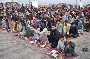 People are waiting for the Maghrib Azaan to break their fast near Islamabad Expressway during the holy fasting month of Ramadan.