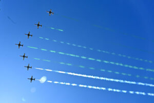 The Pakistan Air Force Karakoram-8 (K-8) aircraft team performs aerobatic manoeuvres during the National Day parade as they fly past near the President's House.