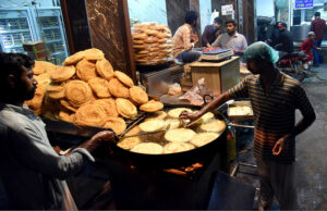 Vendors prepare traditional food item Phani in preparation of the first day of the holy month of Ramadan