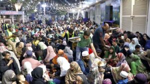 Volunteers prepare food to serve the families for first grant 'Sehri' during the holy fasting month of Ramzan ul Mubarak, free meal distribution by a JDC Foundation Pakistan near the mausoleum of the Quaid-i-Azam, Numaish Chowrangi