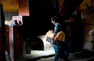 A worker busy in hanging vermicelli to dry after preparing it, as demand has increased during Eidul Fitr.