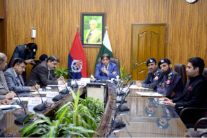 Federal Minister Hanif Abbasi is being briefed by the IG Railways Police on the performance of the Railway Police and the security of the Railways