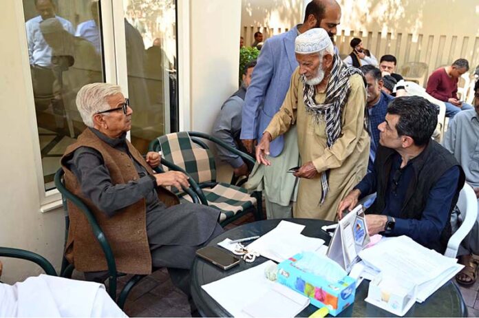 Defense Minister Khawaja Muhammad Asif attentively listens to people's concerns at his residence