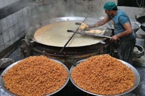 A worker busy in frying and preparing the traditional food item (Pakoriyaa) mostly used in ‘Dahi Bhalle’ during the holy fasting month of Ramzan.