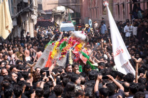 A procession is passing through the inner city near the Wazir Khan Mosque on the occasion of the martyrdom day of Hazrat Ali (RA).