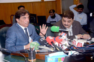 Federal Minister Hanif Abbasi is being briefed by the IG Railways Police on the performance of the Railway Police and the security of the Railways