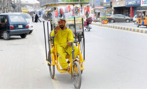 A disable vendor displays and sells different items on his wheelchair for his livelihood.