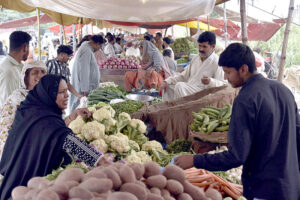 People buying vegetables on subsidy rates at special Ramadan Bazar near Shadman Town