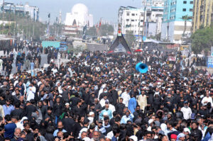 Mourners offering Zuhr prayers at M A Jinnah Road observing the Martyrdom Day of Hazarat Ali (AS).