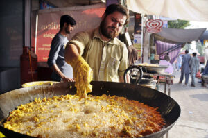 A Pakora Samosas seller in a local bazaar near Shadman town specially stablished in the fasting month of Ramadan