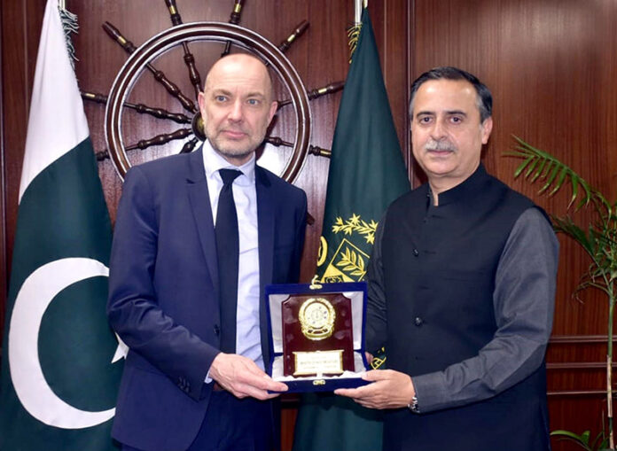 Federal Minister for Maritime Affairs, Muhammad Junaid Anwar Chaudhry, presents a souvenir to the Ambassador of Denmark, Jakob Linulf, during their meeting on bilateral Maritime Cooperation