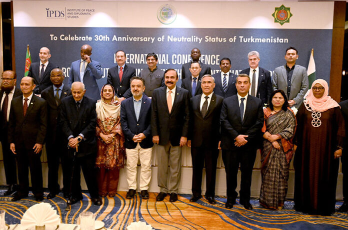 Federal Minister for Parliamentary Affairs Dr. Tariq Fazal Chaudhry and Ambassador of Turkmenistan to Pakistan, Atajan Movlamov in a group photo with the dignitaries at the International Conference on ‘The Role of Neutrality in Strengthening International PEACE’ organized by Embassy of Turkmenistan to Pakistan with the collaboration of Institute of Peace and Diplomatic Studies to celebrate 30th Anniversary of Neutrality Status of Turkmenistan at a local hotel