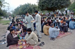 Volunteers distributing food among the people to break their fast during the holy fasting month of Ramadan.