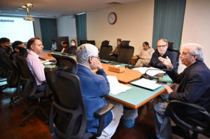 Federal Minister For National Food Security Rana Tanveer Hussain addressing a meeting on disposal of wheat at PASSCO Office.