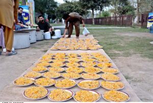 Volunteers distributing food among the people to break their fast during the holy fasting month of Ramadan.