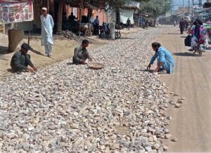 Labourers are busy working on Badr Sher Road as part of several ongoing development schemes in the district.